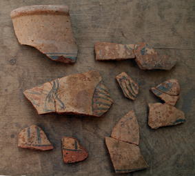Fragments of a bichrome painted Nile clay jar from Elephantine.