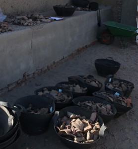 The sherds arrive in large baskets in the digging house.